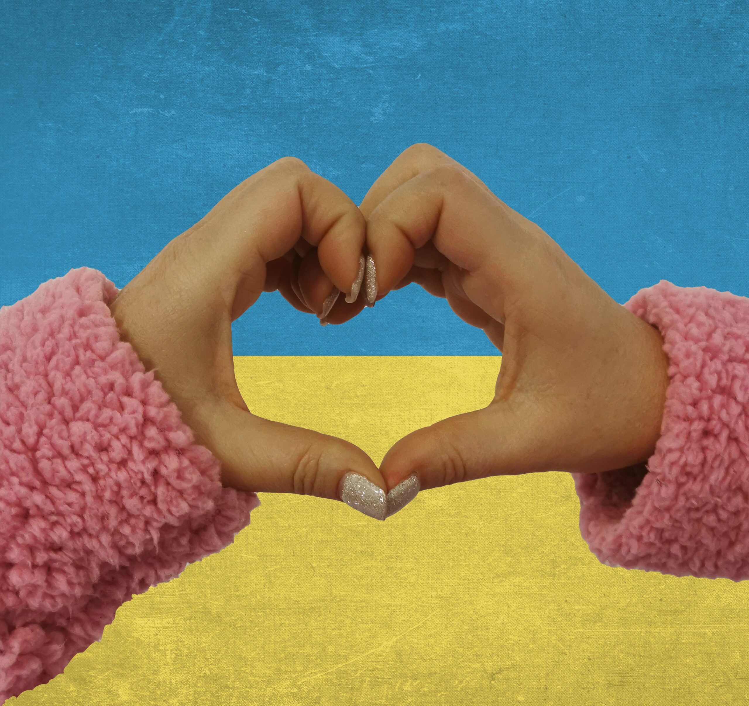 Modro-žlté srdce v objímajúcich rukách ako symbol solidarity s Ukrajinou